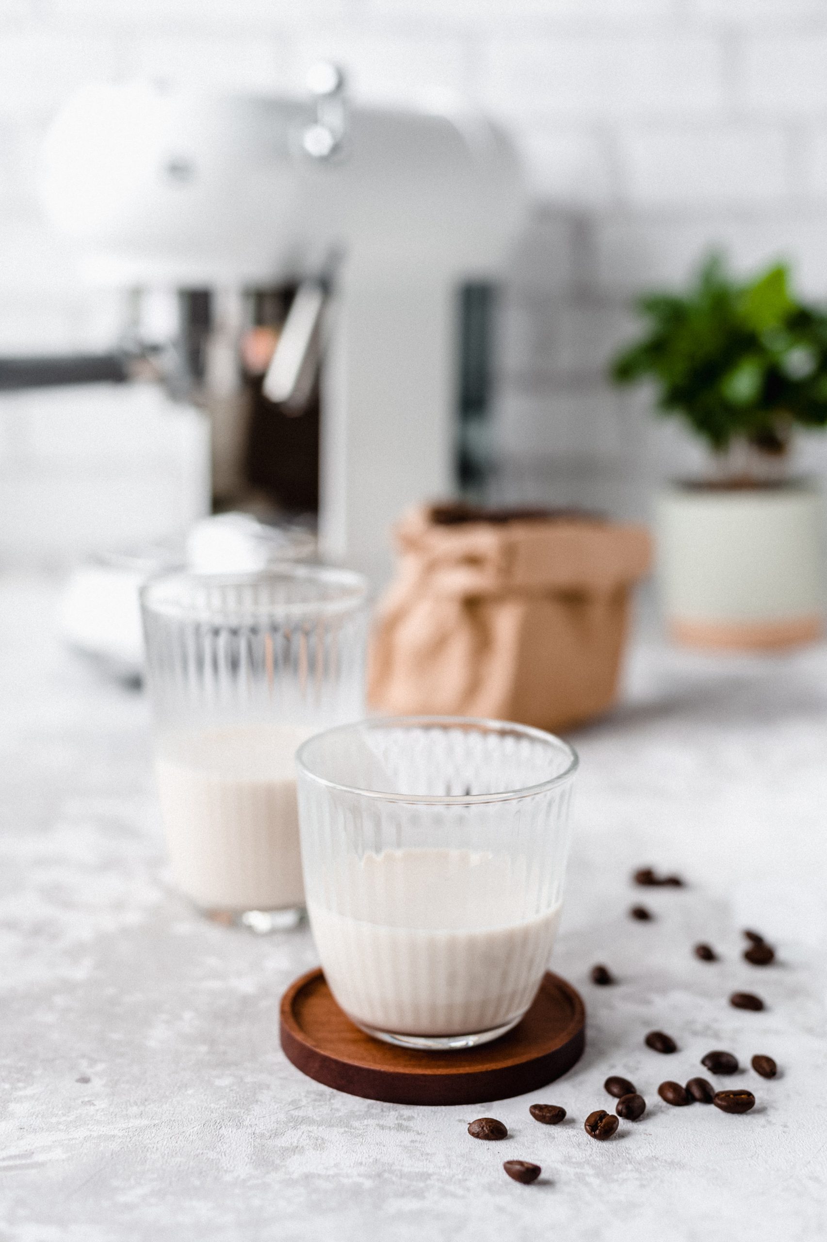 A glass of milk on a counter top shown as a good source of calcium