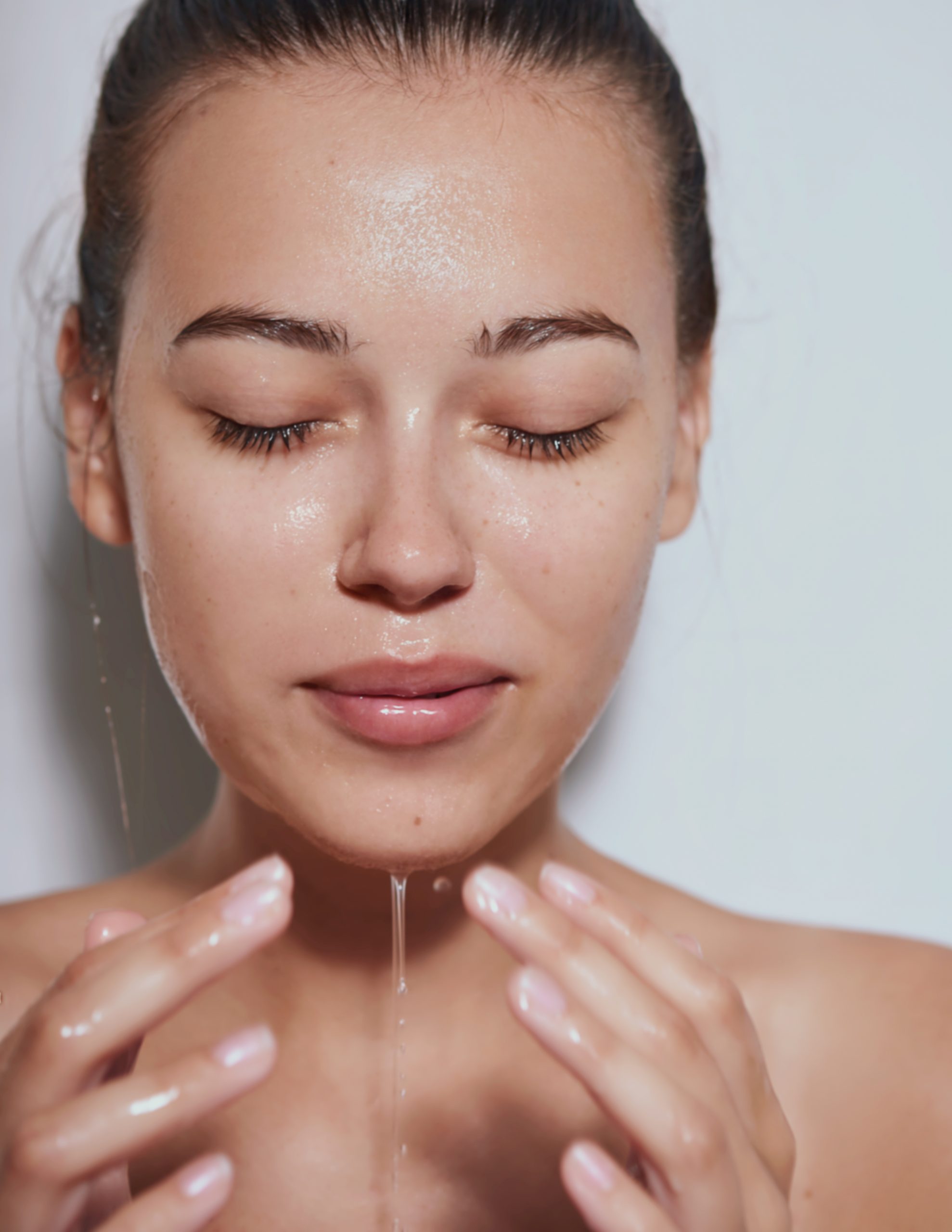 hyaluronic acid benefits - girl with wet, hydrated skin