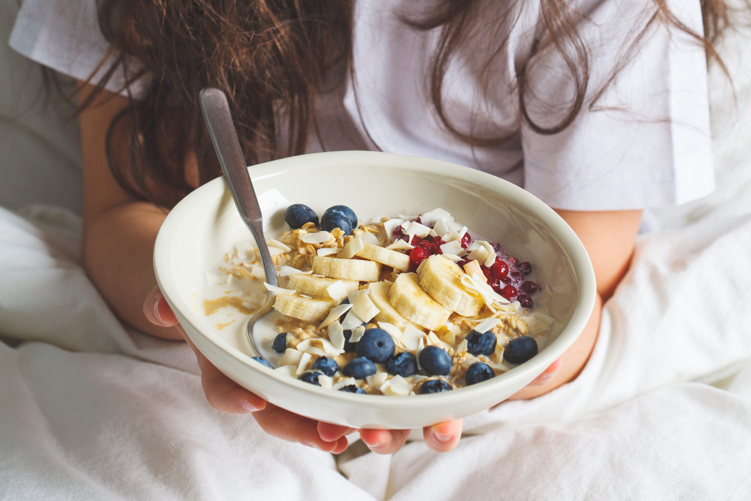 Overnight oatmeal with berries, banana, Pro You Pea or Whey Protein Powder and coconut.